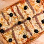 Homemade spelt flour pizza with anchovies